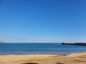 On the beach, sun-loungers