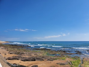 On the beach, sun-loungers