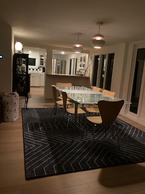 Enjoy meals in this stylish dining area with a glass-top table and comfortable seating for four.