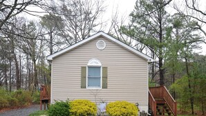 A small, single-story building with a gabled roof and a front porch. - Welcome to Bayside Breeze! One Block From Town Beach, Walk to Waterfront Dining (Rock Hall)