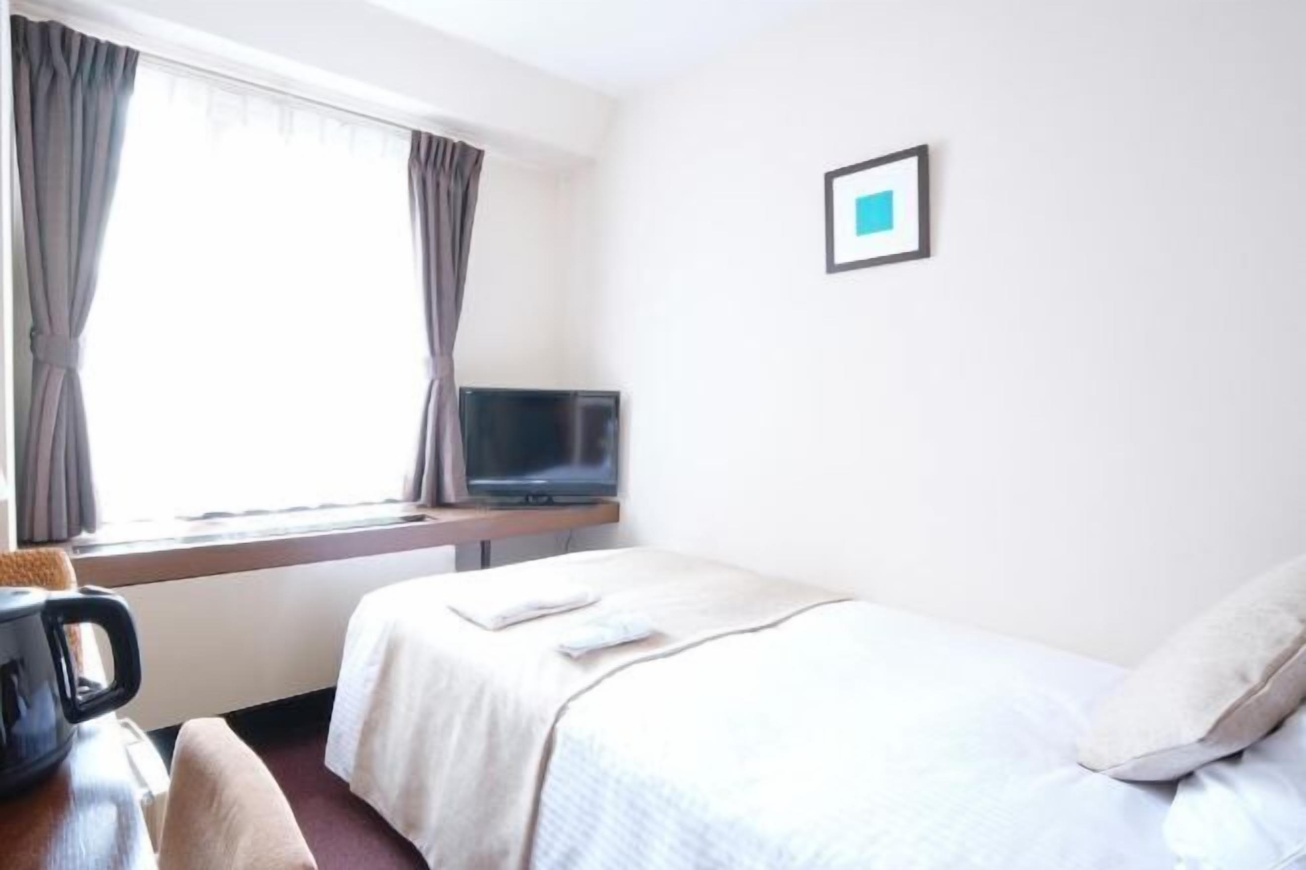 Desk, blackout curtains, free WiFi, bed sheets