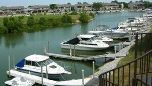 A marina with several boats docked along a waterfront. - 1ST floor Condo NO STAIRS, beaches ,pool cedar point camp perry marsh parks,<br> (Oak Harbor)