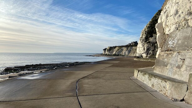 A coastal walkway with a concrete path, white cliffs, and a view of the sea. - 3 bedroom accommodation in Ramsgate (Ramsgate)