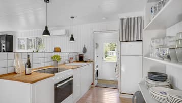 Fridge, stovetop, coffee/tea maker, cookware/dishes/utensils
