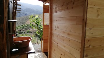 Combined shower/tub, bathrobes, slippers, towels