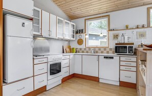 Fridge, stovetop, dishwasher, coffee/tea maker