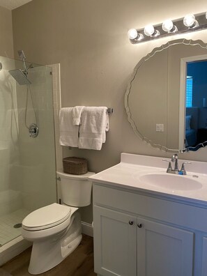 Combined shower/bathtub, hair dryer, towels, soap