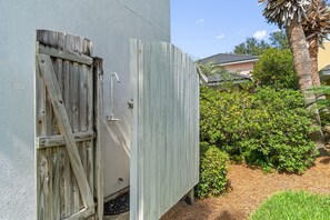 A wooden shed with a metal door and a metal faucet. - “Beach Jewel” 5 bdrm , 3 1/2<br>bath home.  5 min walk to the beach (Destin)