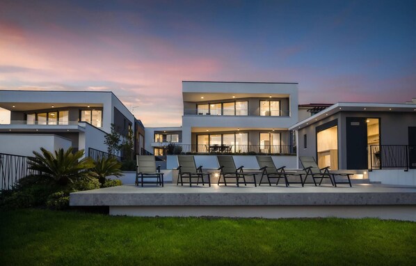 Relax in a spacious outdoor area with a seating arrangement, and enjoy outdoor spaces from multiple balconies.