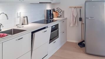 Fridge, stovetop, dishwasher, coffee/tea maker