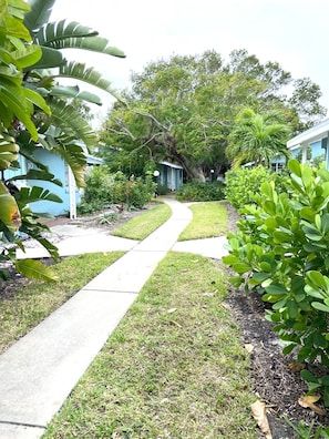 Stroll through the lush garden to a serene and residence.