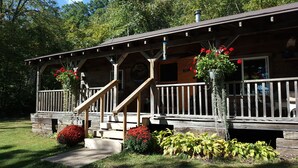 A wooden cabin with a porch, steps, and a sign that reads "Welcome". - Rustic, small and primitive cabin - Riverview Cabin, LLC (Muscoda)