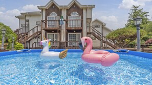 Seasonal outdoor pool, open 9:00 AM to 7:00 PM, pool umbrellas