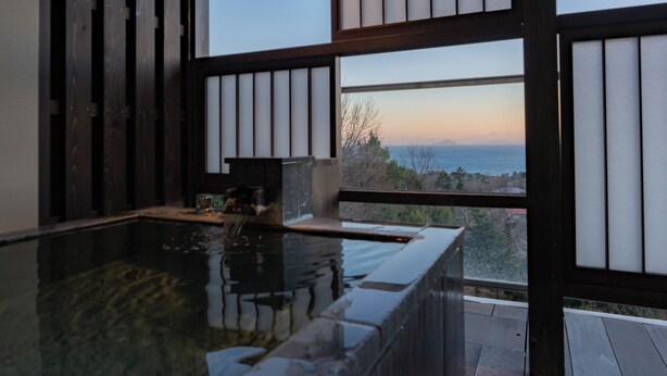 A traditional Japanese-style room with tatami flooring, a wooden sliding door, and a view of the sea. - Omuro no Mori Gyokusui - 13 years or older - (Ito)
