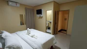 Standard Double or Twin Room | Minibar, in-room safe, laptop workspace, iron/ironing board