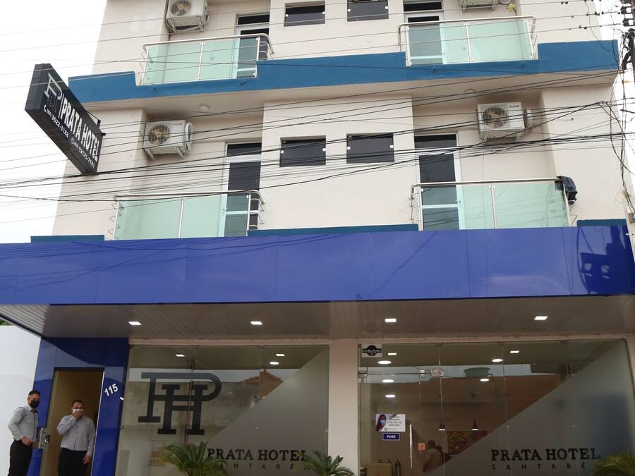 A building with a sign for 'Prata Hotel' and a staircase leading to the entrance.