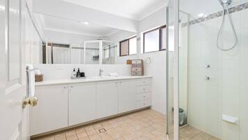 Shower, hair dryer, towels, shampoo