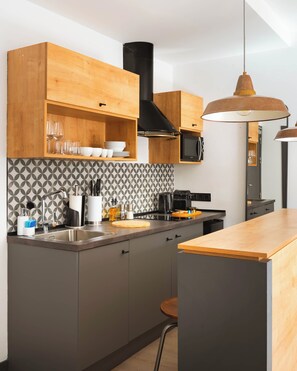 One-Bedroom Apartment with Balcony | Private kitchen | Fridge, microwave, stovetop, espresso maker