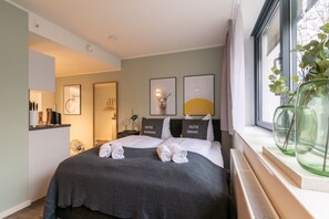 Suite | Espacio para trabajar con laptop, wifi gratis y ropa de cama 
