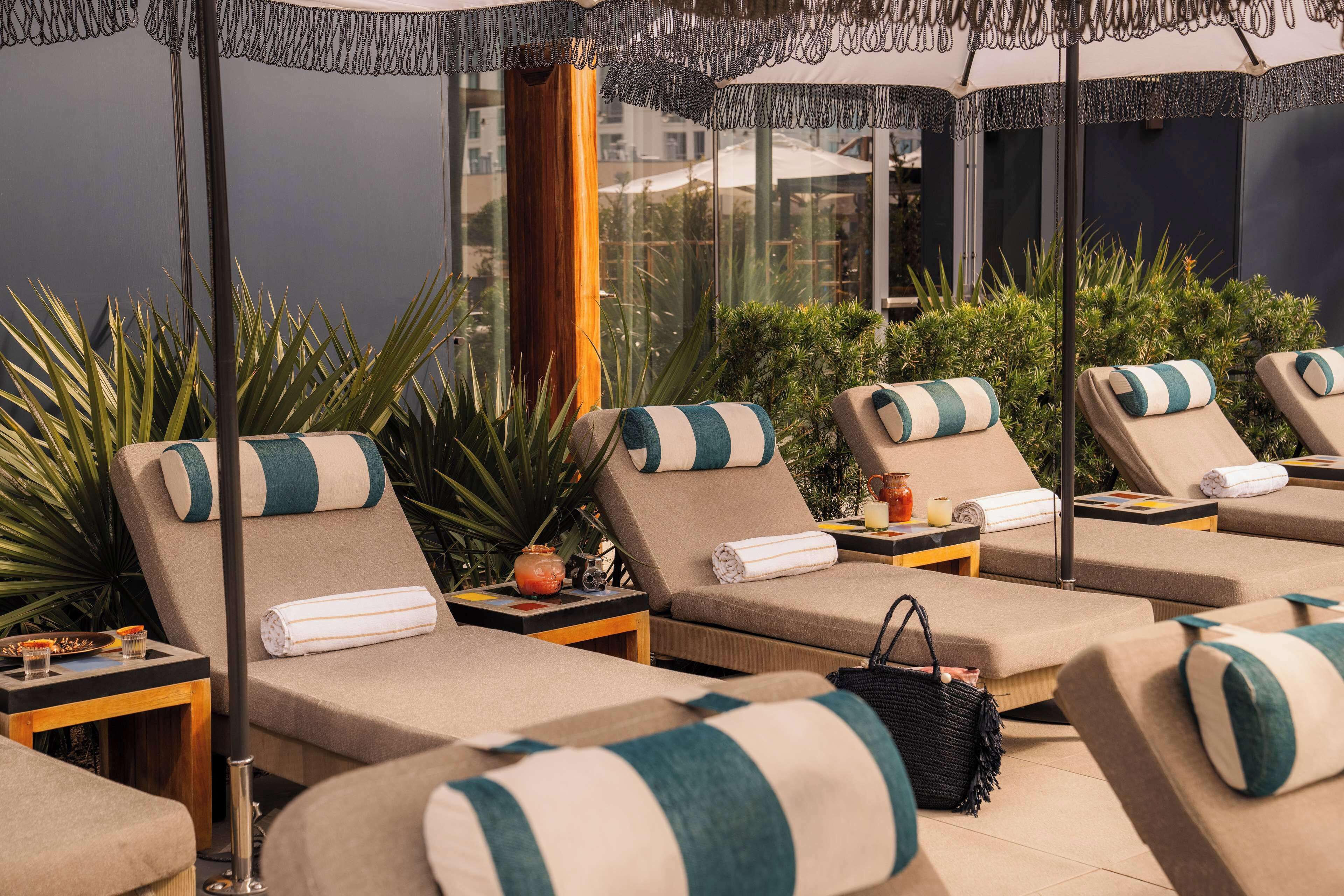 Outdoor pool, open 7:00 AM to 7:00 PM, cabanas (surcharge), sun loungers