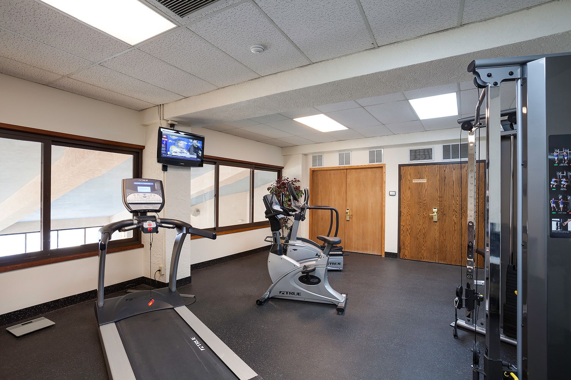 Stay active during your getaway in this well-equipped fitness center featuring cardio machines, strength training equipment, and natural light to energize your workouts.