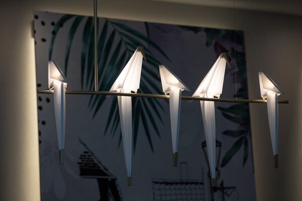 A modern chandelier with multiple light fixtures. - Hampton by Hilton York Piccadilly (York)