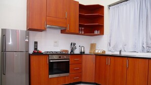 Apartment, 1 Queen Bed | Private kitchen - Deluxe 1- Bedroom Apartment With Swimming Pool (Kampala)