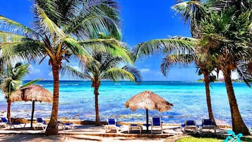 On the beach, sun-loungers, beach towels