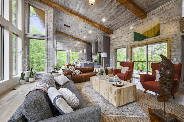 Open concept living, dining and kitchen with loads of windows.