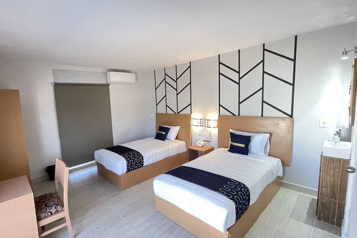 standard twin room | premium bedding, select comfort beds, individually furnished, desk