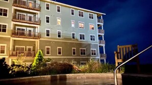 A multi-story hotel with balconies and a swimming pool. - Luxury Ski-In/Out Condo – 305 Soaring Eagle, Stunning Sunrise Views & Hot Tubs! (Snowshoe)