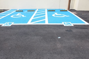 Accessible parking spaces are clearly marked with blue paint and wheelchair symbols.