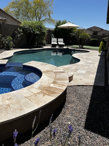 Great family friendly home very private back yard, heated pool & covered patio.