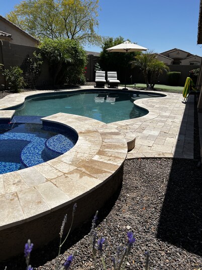 Great family friendly home very private back yard, heated pool & covered patio.