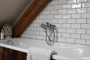 Bathtub, hair dryer, towels, soap