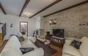 Smart TV, fireplace, table football, books