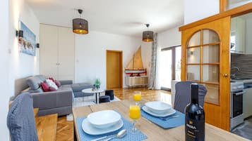 Family Apartment, Multiple Bedrooms, 2 Bathrooms (Exclusive Pool Escape Near Sea) | Living area | 21-inch flat-screen TV with digital channels, TV