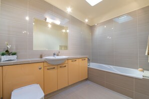 Bathtub, hair dryer, towels, soap