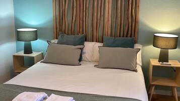 2 habitaciones, tabla de planchar con plancha, internet y ropa de cama