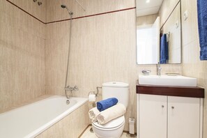 Bathtub, hair dryer, towels