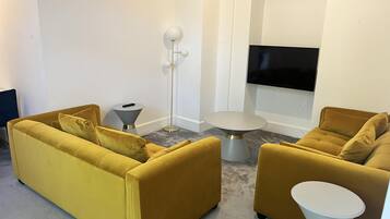 Apartment, 2 Queen Beds | Living area | 30-inch TV with digital channels, fireplace