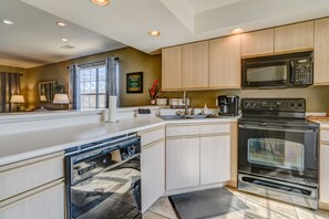 Fridge, coffee/tea maker, cookware/dishes/utensils