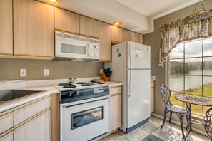 Fridge, coffee/tea maker, cookware/dishes/utensils