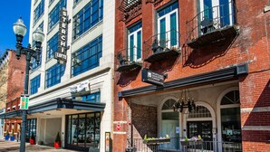 A building with a sign for 'Sterchi Lofts' and 'Mortgage Investors Group'. - Historic Sterchi Loft on Gay St (Knoxville)