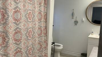 Combined shower/tub, hair dryer, towels, soap