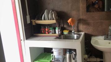 Fridge, microwave, coffee/tea maker, dining tables