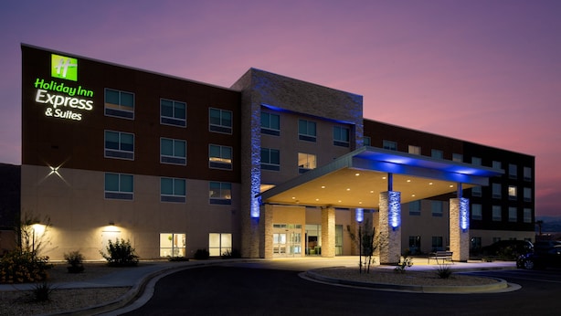 A Holiday Inn Express & Suites building with a modern design, featuring a covered entrance and a landscaped area in front. - Holiday Inn Express & Suites Bullhead City by IHG (Bullhead City)