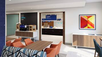 A modern kitchen with a breakfast bar, a coffee station, and a colorful abstract painting.