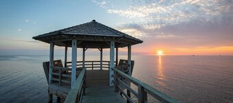 Stunning sunsets, private harbor, beach walks, fishing from the pier.