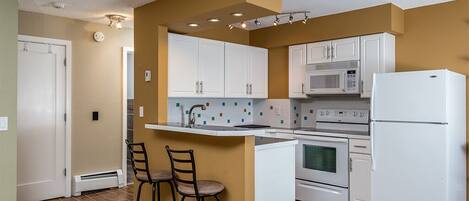 Fridge, microwave, stovetop, coffee/tea maker